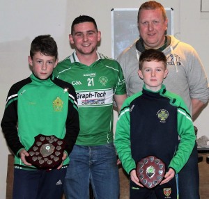 Aughlisnafin U12.5 championship winning team joint captains Rhys Clarke and Marc Quinn with managers Ciaran Rice and Wayne Pickering